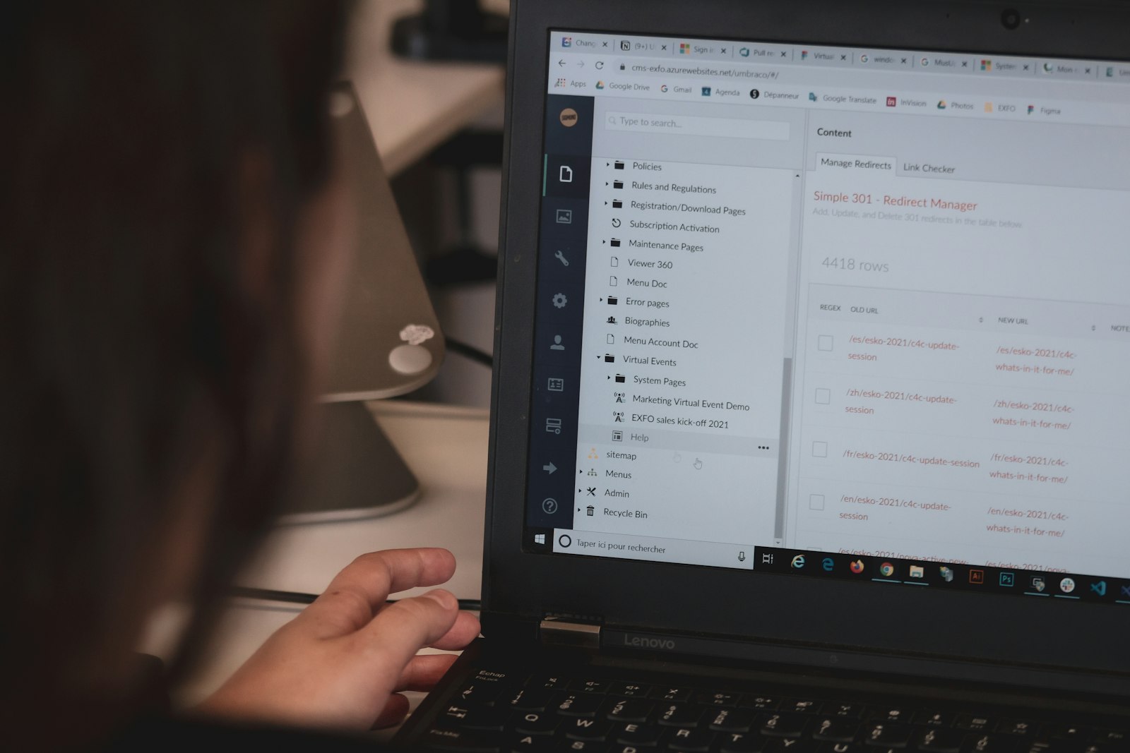 Person reviewing website content on a laptop