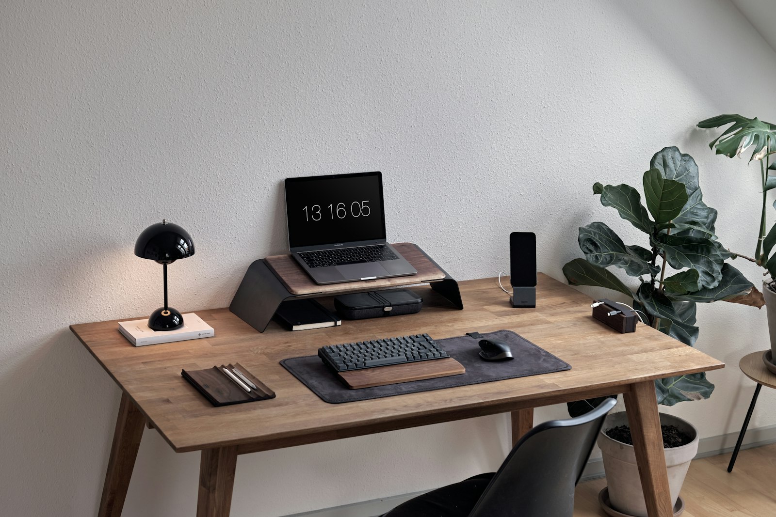 Laptop and phone on a modern work desk
